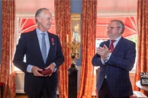 Jaap Scholten receiving the Ukrainian Order of Merit from Ambassador Kostin for Protect Ukraine's life-saving work.
